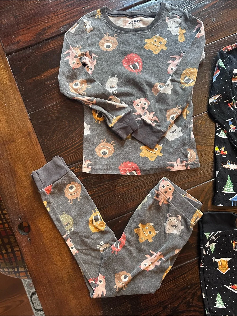 Old Navy Two-Pack Kids Pajama Sets - Gray Monster & Black Holiday Prints